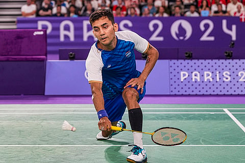 Lakshya Sen returns to Lee Zii Jia during the men's singles bronze medal match